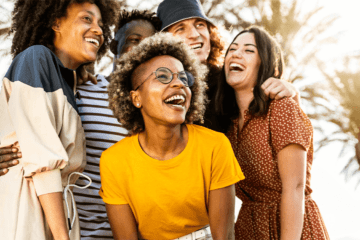 People smiling and laughing in the sun