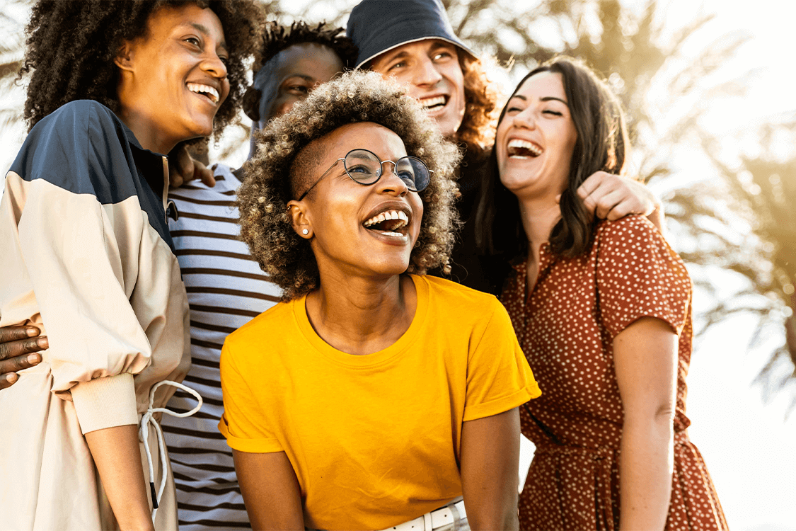 People smiling and laughing in the sun