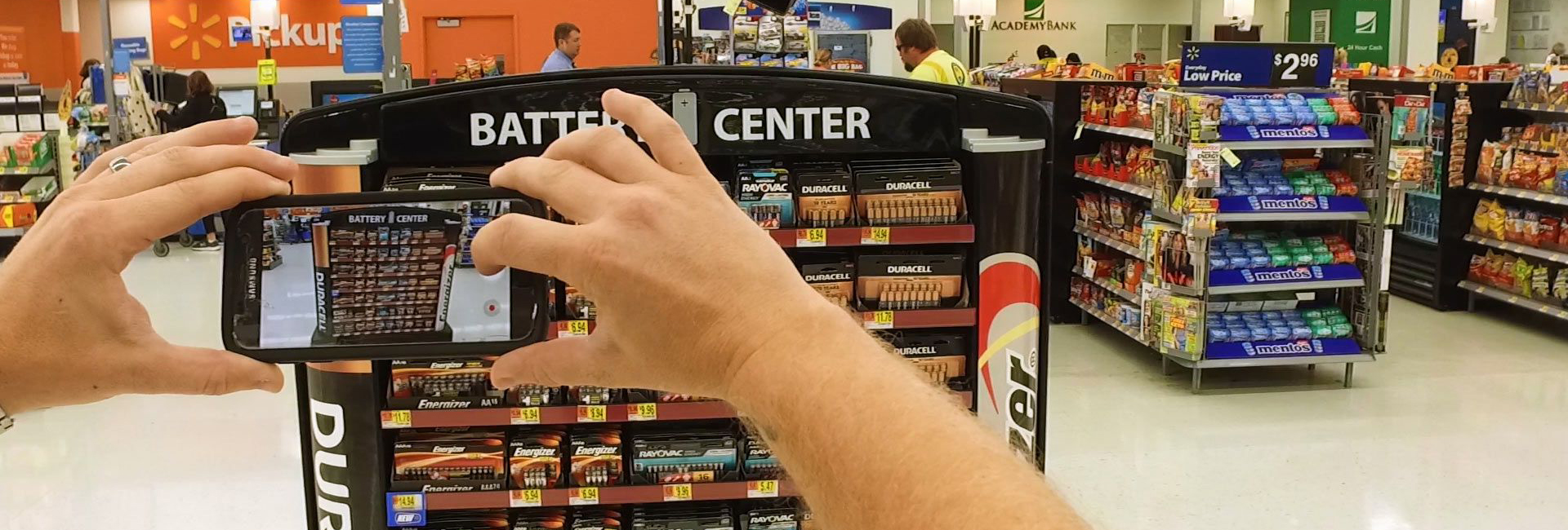 Someone taking a photo of a display