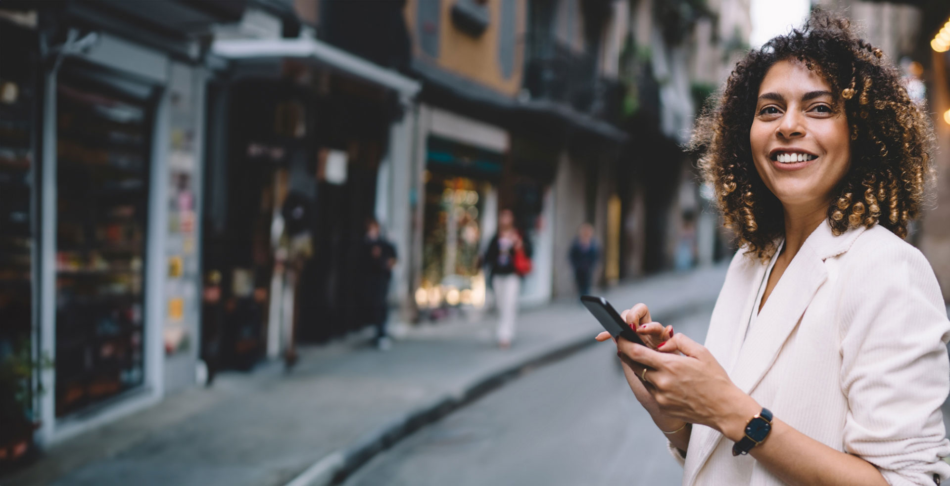 Woman on her phone in a street